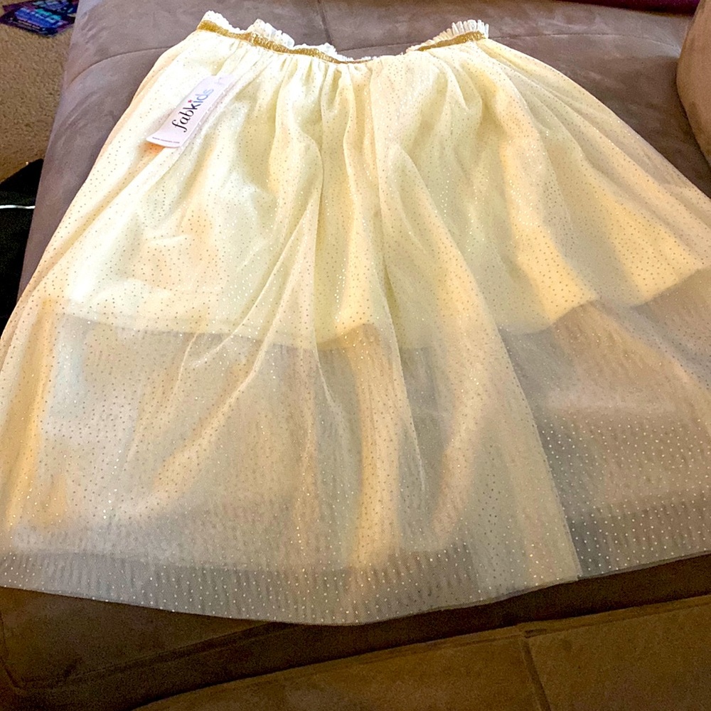 Cream skirt with gold trimming and glitter dots